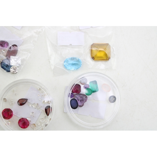 341 - A group of vintage loose gemstones, including garnets, tourmaline, heart cut amethyst, topaz, agate ... 