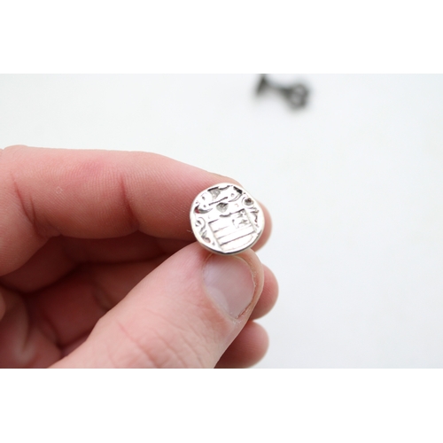 45 - A group of seals including an early bronze seal, possibly medieval, with stag's head impression, a v... 