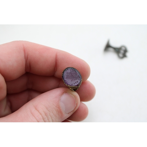 45 - A group of seals including an early bronze seal, possibly medieval, with stag's head impression, a v... 