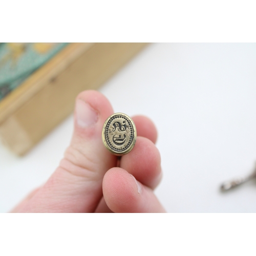 45 - A group of seals including an early bronze seal, possibly medieval, with stag's head impression, a v... 