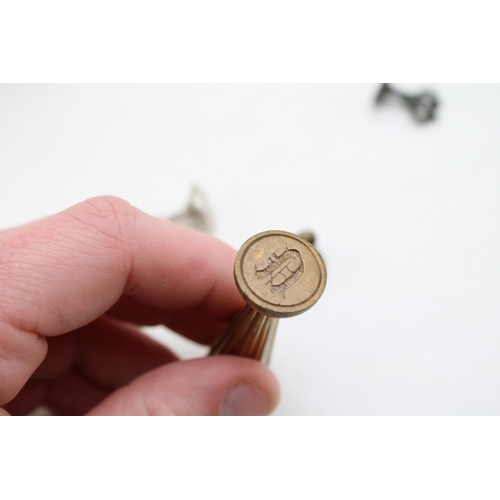 45 - A group of seals including an early bronze seal, possibly medieval, with stag's head impression, a v... 