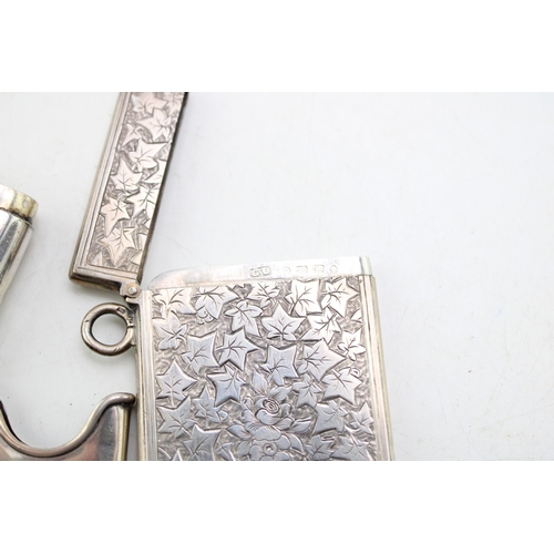 49 - A Victorian silver card case of rectangular form, the whole engraved throughout with ivy leaves, wit... 