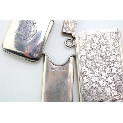 49 - A Victorian silver card case of rectangular form, the whole engraved throughout with ivy leaves, wit... 