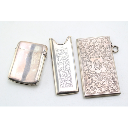 49 - A Victorian silver card case of rectangular form, the whole engraved throughout with ivy leaves, wit... 