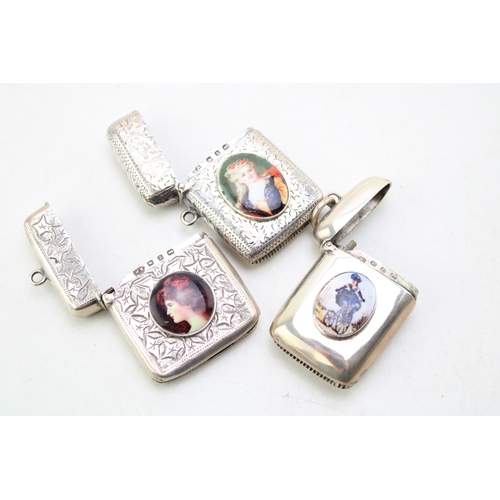 53 - A group of three late Victorian vesta cases, each with applied female portrait plaque including one ... 