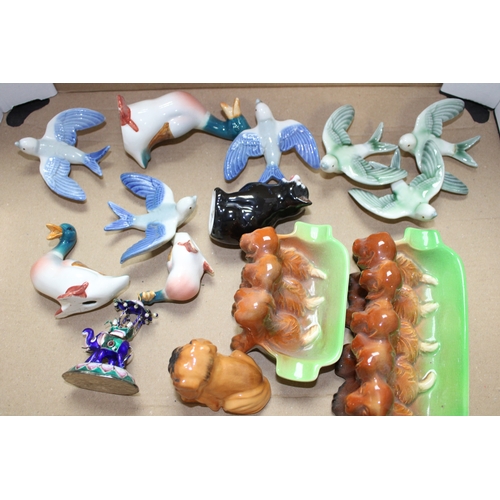 117 - Pottery to include Wade swallows, Beswick ducks, dogs and Royal Doulton etc (Qty).