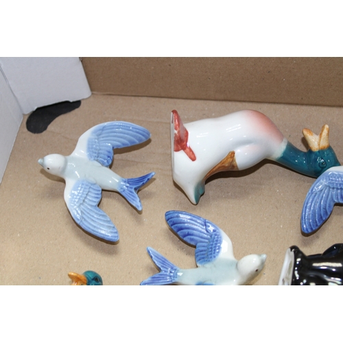 117 - Pottery to include Wade swallows, Beswick ducks, dogs and Royal Doulton etc (Qty).
