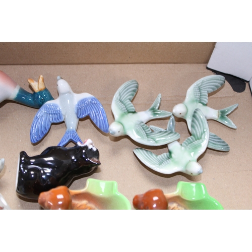 117 - Pottery to include Wade swallows, Beswick ducks, dogs and Royal Doulton etc (Qty).