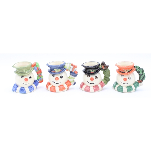183 - Four boxed Royal Doulton miniature character jugs to include Snowman jugs, made for Sinclairs (4).