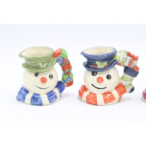 183 - Four boxed Royal Doulton miniature character jugs to include Snowman jugs, made for Sinclairs (4).