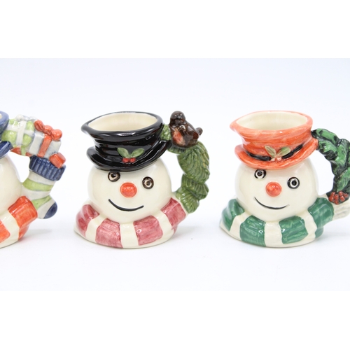 183 - Four boxed Royal Doulton miniature character jugs to include Snowman jugs, made for Sinclairs (4).