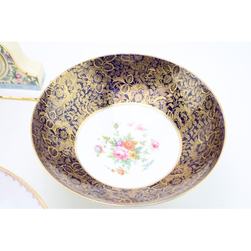 265 - Three Minton footed bowls together with a Wedgwood clock 'Sarah' pattern, (4).