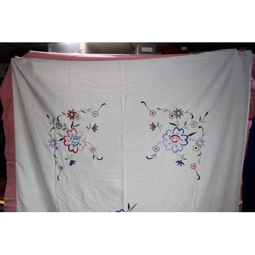 287 - Vintage bedspread, hand embroidered with floral design and pink border, 186cm x 224cm.