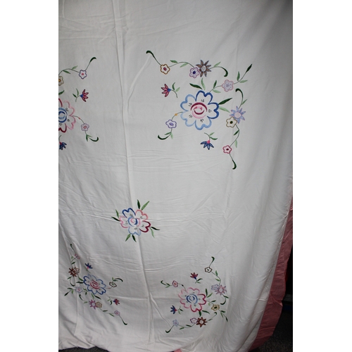 287 - Vintage bedspread, hand embroidered with floral design and pink border, 186cm x 224cm.