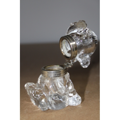 291 - A bonzo glass and white metal inkwell, 9cm tall.