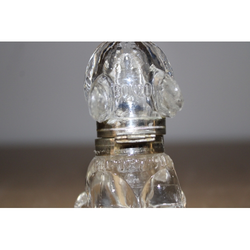 291 - A bonzo glass and white metal inkwell, 9cm tall.