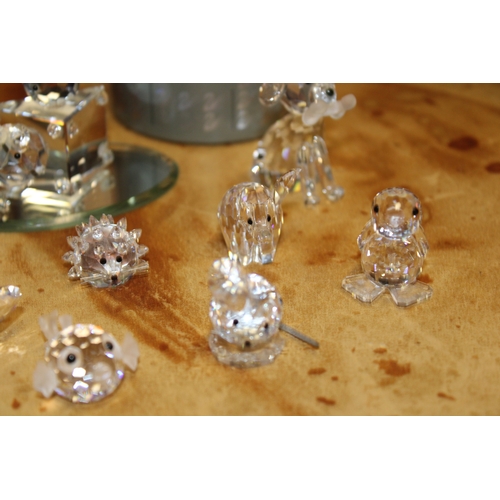293 - Swarovski Crystal figures to include boxed owl and dragon together with fish, hedgehog and butterfly... 