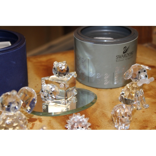 293 - Swarovski Crystal figures to include boxed owl and dragon together with fish, hedgehog and butterfly... 