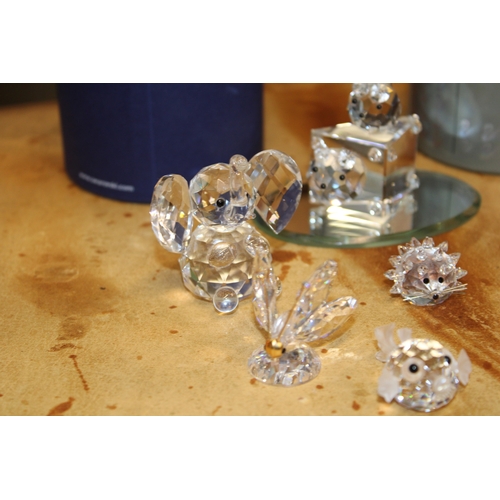 293 - Swarovski Crystal figures to include boxed owl and dragon together with fish, hedgehog and butterfly... 