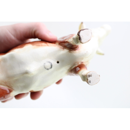 139 - Beswick to include an early Hereford Bull 949 with a Guernsey Bull (2).