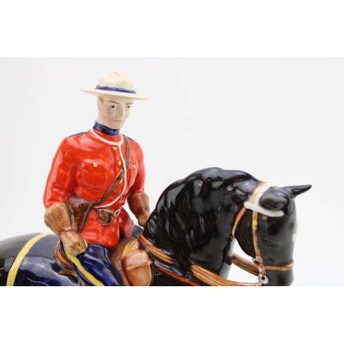 152 - Beswick Canadian Mountie on ceramic base (restored ear).