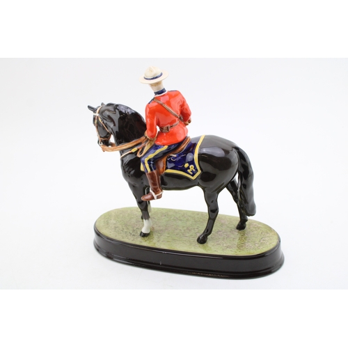 152 - Beswick Canadian Mountie on ceramic base (restored ear).