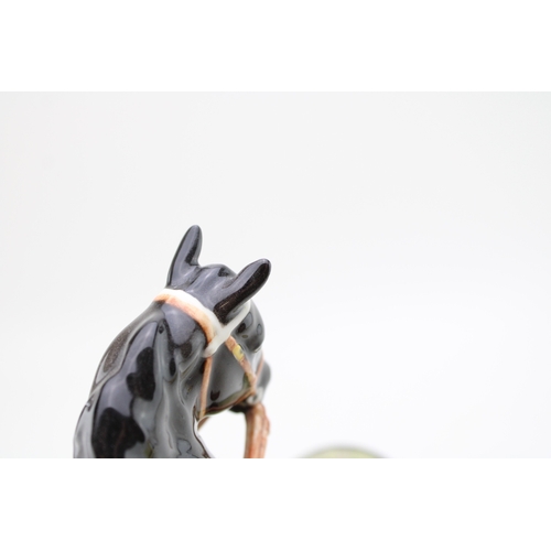 152 - Beswick Canadian Mountie on ceramic base (restored ear).