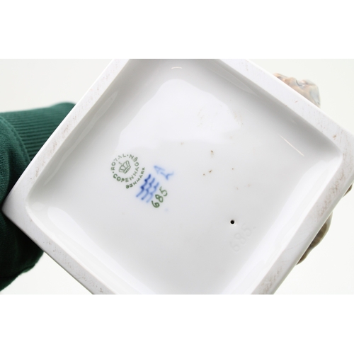 177 - A Royal Copenhagen figure of a farmer with scythe 685 with a B&G figure of a boy with a puppy (2).