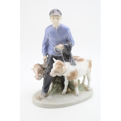 184 - Royal Copenhagen porcelain figure of a boy with two calves, 1858.