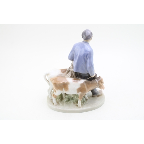 184 - Royal Copenhagen porcelain figure of a boy with two calves, 1858.