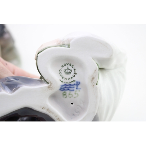 189 - Royal Copenhagen figures to include a Boy Whittler 905and a shepherd eating lunch 865 (2).