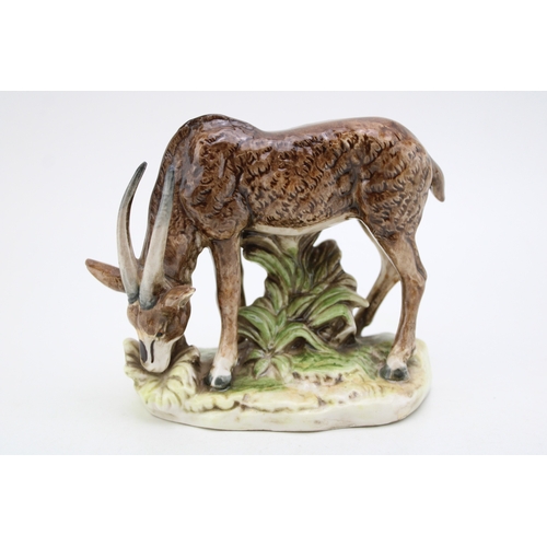 196 - A pottery model of an Antelope, possibly Saxony, S under a crown, 14cm tall.