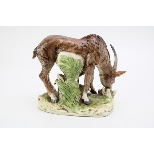 196 - A pottery model of an Antelope, possibly Saxony, S under a crown, 14cm tall.