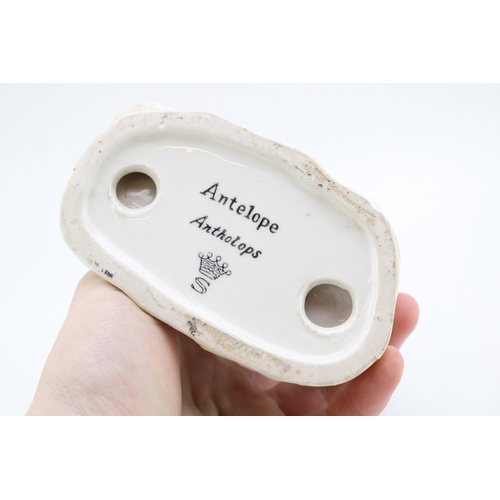 196 - A pottery model of an Antelope, possibly Saxony, S under a crown, 14cm tall.