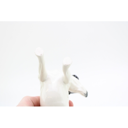 197 - Elite Pottery figure of a Jack Russell, 14cm long.