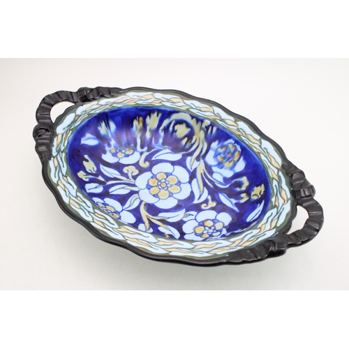 212 - Frederick Rhead for Royal Cauldon England, oval shaped footed bowl, floral decoration on cobalt blue... 