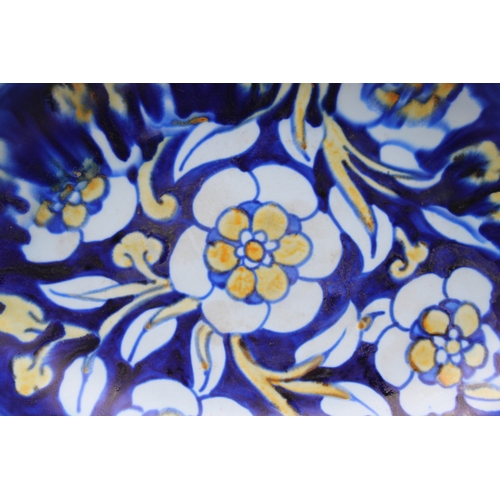 212 - Frederick Rhead for Royal Cauldon England, oval shaped footed bowl, floral decoration on cobalt blue... 