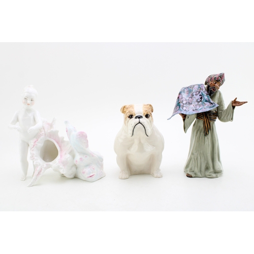 213 - A Janus pottery figure of a child with a cornucopia shell, a Royal Doulton bulldog and a Cooper Clay... 