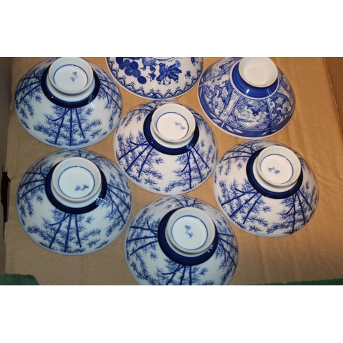 229 - Set of eleven Japanese blue and white rice bowls, together with a sake cup, (12).