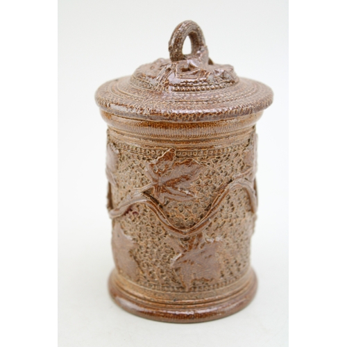 241 - A Victorian stoneware jar and cover, with ivy vine decoration, 13.5cm tall.