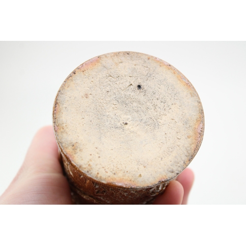 241 - A Victorian stoneware jar and cover, with ivy vine decoration, 13.5cm tall.