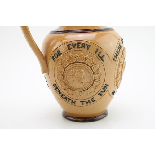 257 - Doulton Lambeth stoneware moto jug, 'For Every Ill Beneath the Sun...', 19cm tall.