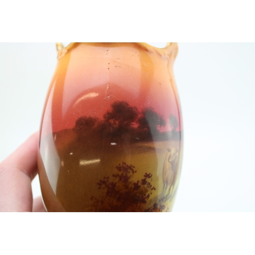 267 - Royal Doulton pair of vases, with sheep at sunset, 17cm tall (2).