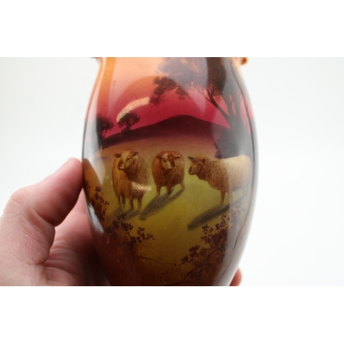 267 - Royal Doulton pair of vases, with sheep at sunset, 17cm tall (2).