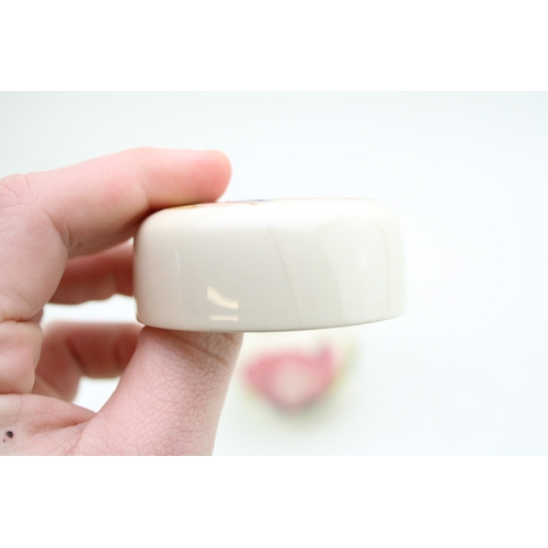 27 - A Moorcroft floral vase with a hibiscus on cream ginger jar, tallest 11.5cm tall (2), hairline to li... 