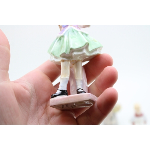 303 - Royal Doulton figures to include Two a Penny, Balloon Seller HN2130, Falstaff HN3236, Christmas Morn... 