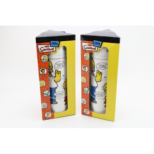 323 - Two boxed Coalport sets of The Simpsons stacking mugs (2 boxed sets of 4).