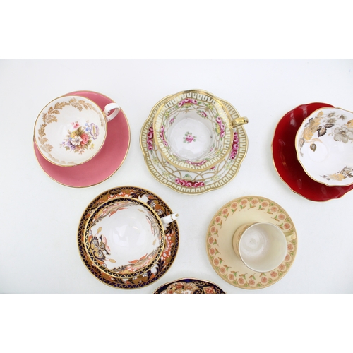 334 - A collection of six cups and saucers, all with floral designs, to include Royal Albert, Royal Crown ... 