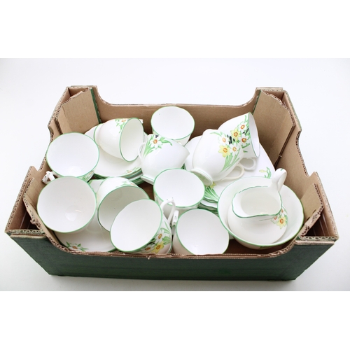 344 - A New Chelsea Staffs part tea service in the Sweet Nancy design to include eleven cups, saucers and ... 