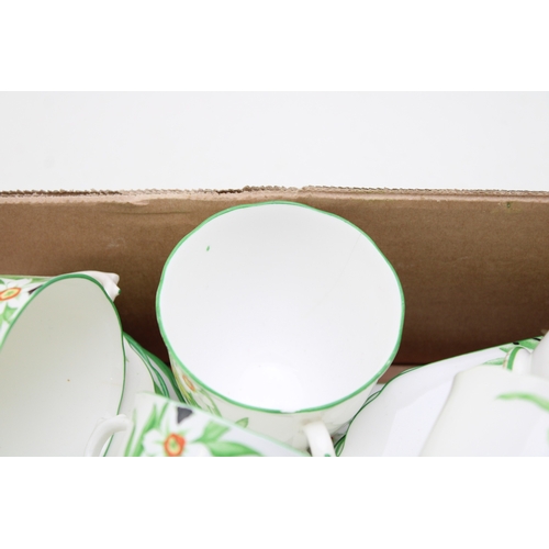 344 - A New Chelsea Staffs part tea service in the Sweet Nancy design to include eleven cups, saucers and ... 